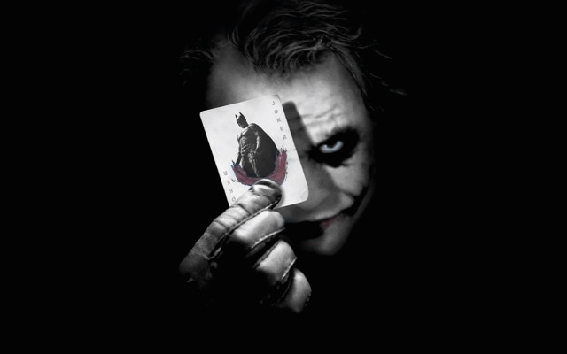 Man holding joker card painted free wallpaper - medium preview image