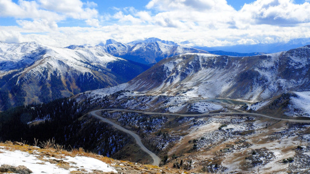 Winding road mountain range snow free wallpaper - medium preview image