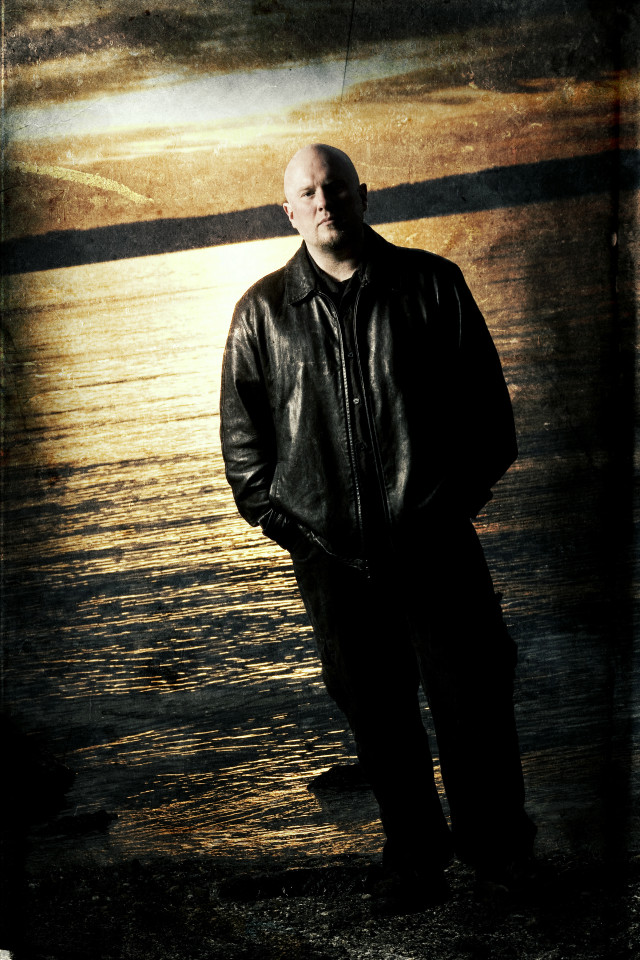 Man standing water leather jacket free wallpaper - medium preview image