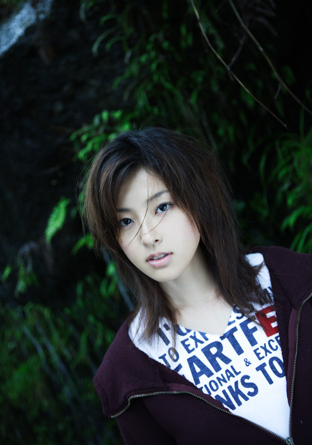 Woman hoodie pose tree bushes free wallpaper - medium preview image