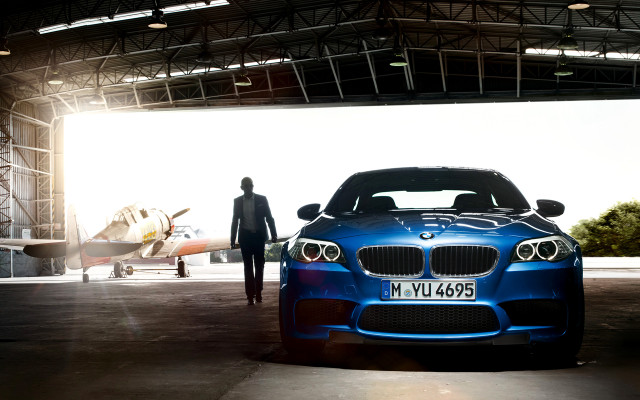 Man blue car hangar plane free wallpaper - medium preview image