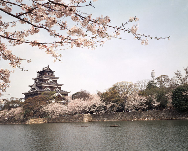 Large building hill lake boat free wallpaper - medium preview image