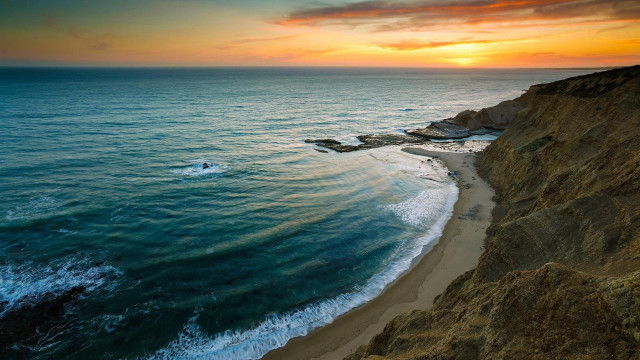Sunset beach waves cliff water free wallpaper - medium preview image