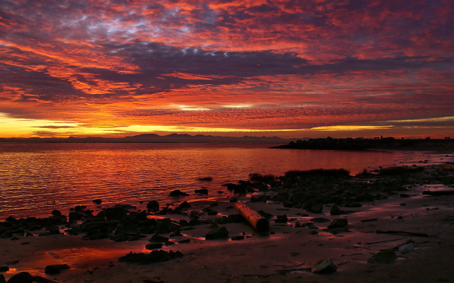 Sunset water rocks boats shore free wallpaper - medium preview image