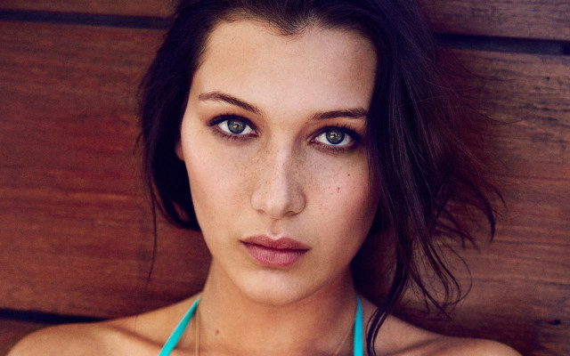 Woman blue bikini necklace posing free wallpaper - medium preview image