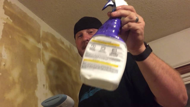 Man holding paint bottle sprayer free wallpaper - medium preview image