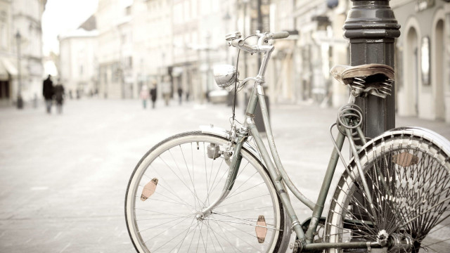 Bicycle parked city street people free wallpaper - medium preview image