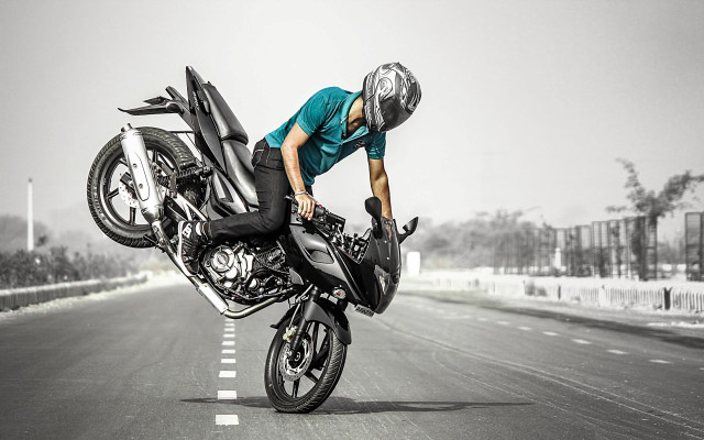 Man motorcycle trick road helmet free wallpaper - medium preview image