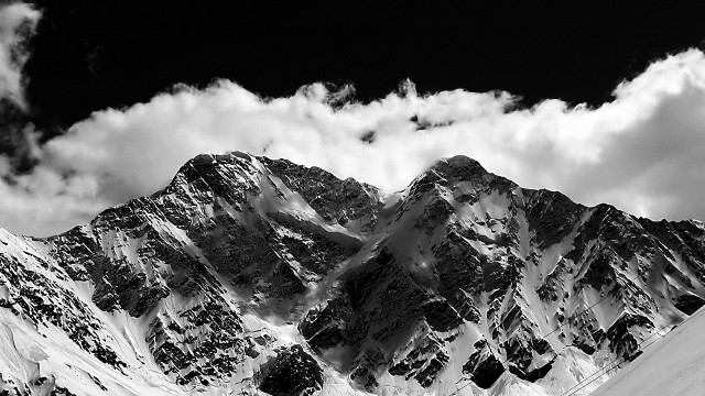 Snowboarder snowy mountain slope sky free wallpaper - medium preview image