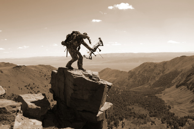 Man backpack bow rock mountains free wallpaper for desktop - medium preview image