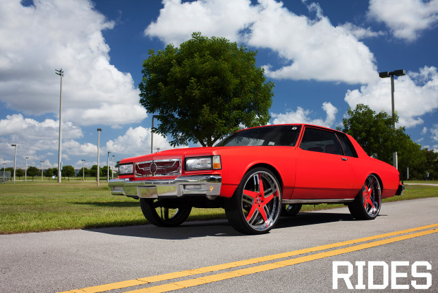 Red car parked road grass #2 free wallpaper - medium preview image
