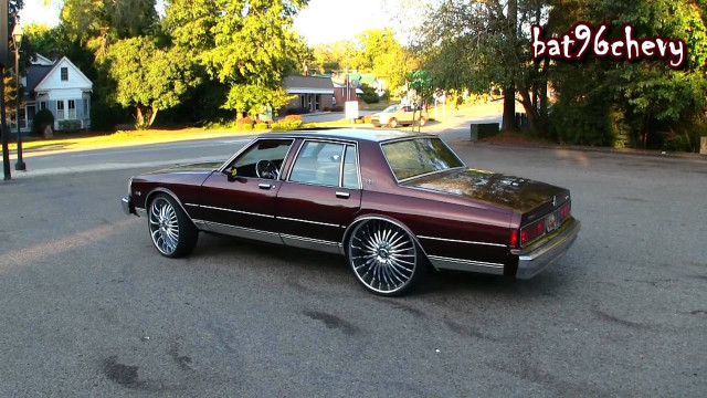 Maroon car parked house trees free wallpaper - medium preview image