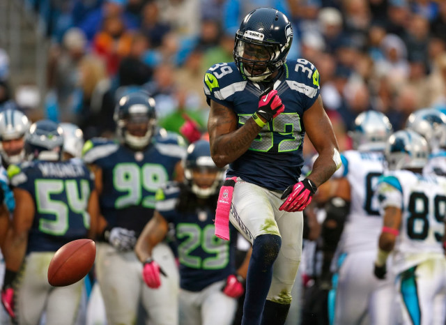 Football player running crowd sidelines free wallpaper - medium preview image