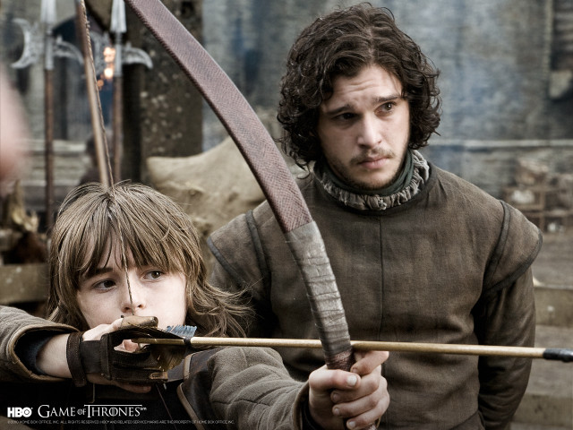 Man boy bow arrow holding free wallpaper - medium preview image