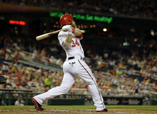 Baseball player swinging bat ball #2 free wallpaper - medium preview image