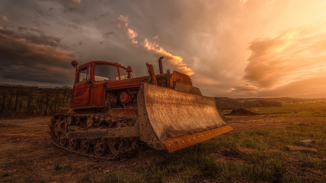 Tractor parked field cloudy sky free wallpaper - medium preview image