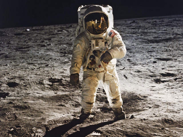 Astronaut walking moon helmet hand free wallpaper - medium preview image