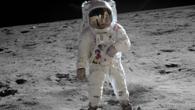 Astronaut standing on moon foot free wallpaper - medium preview image