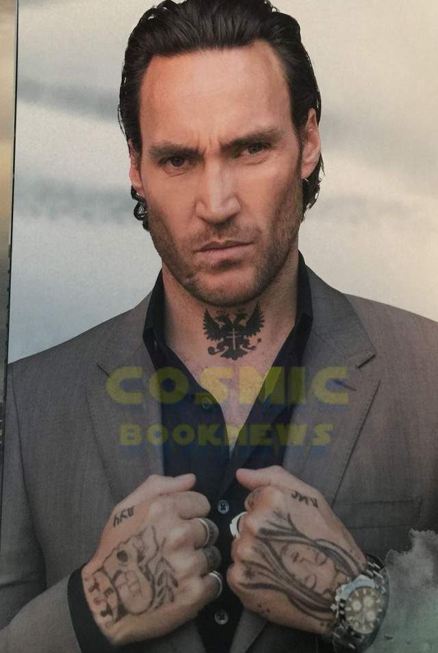 Man tattoos holding watch serious free wallpaper - medium preview image