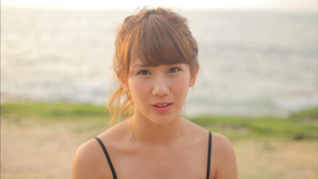 Woman hairdo black top beach free wallpaper - medium preview image