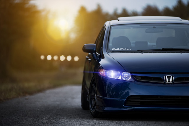 Blue car parked road sun free wallpaper - medium preview image