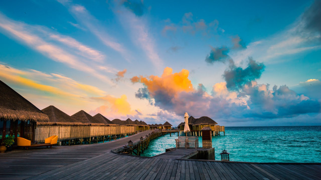 Pier thatched roof clock tower free wallpaper - medium preview image