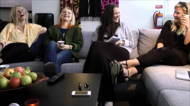 Three women couch laughing drinking free wallpaper - medium preview image