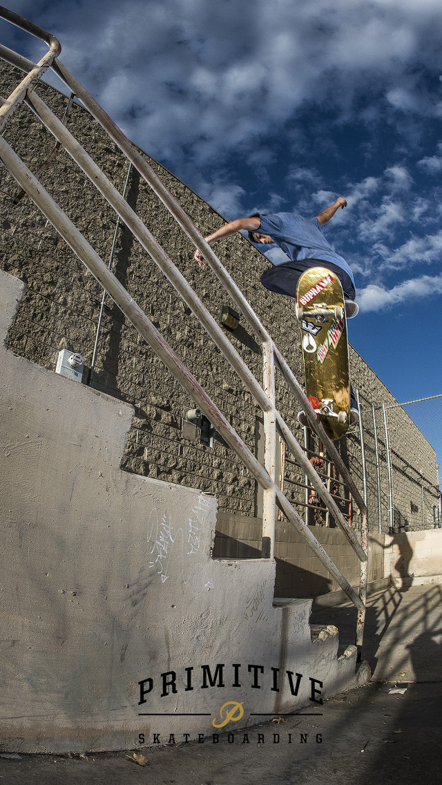 Skateboarder trick rail building sky free wallpaper - medium preview image