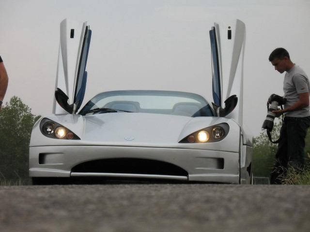 Man white sportscar open doors free wallpaper - medium preview image