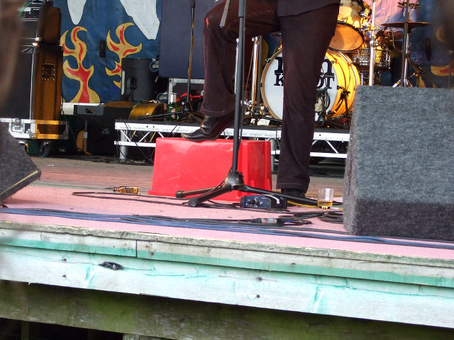 Man standing stage microphone speaker free wallpaper - medium preview image