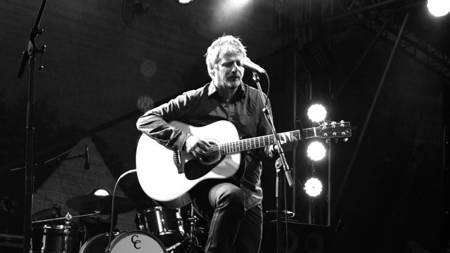 Man playing guitar stage microphone #2 free wallpaper - medium preview image