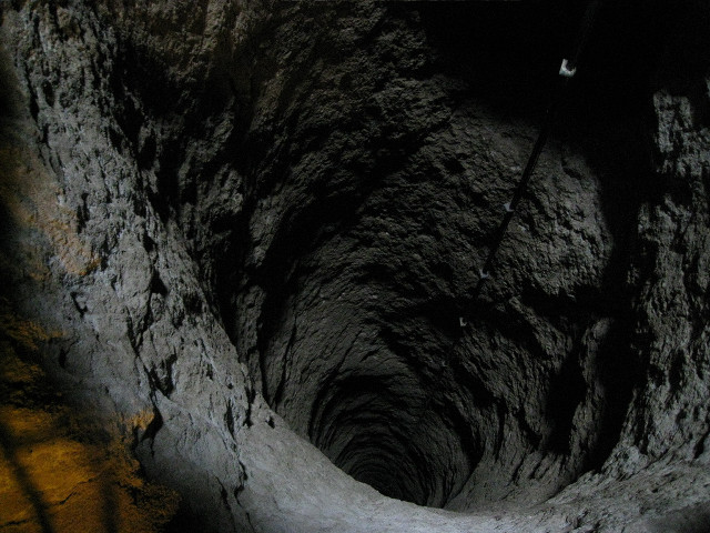Man tunnel cellphone flashlight standing free wallpaper - medium preview image