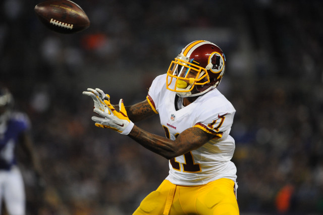Football player catching ball air #2 free wallpaper - medium preview image