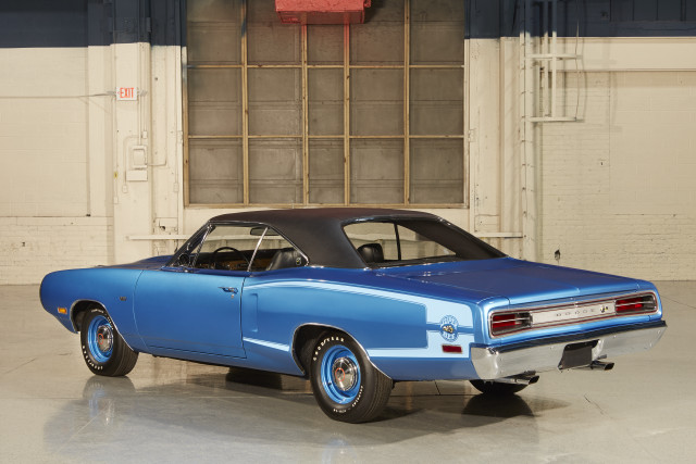 Blue car parked garage wall free wallpaper - medium preview image