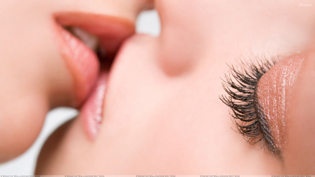 Woman long eyelashes touching face free wallpaper - medium preview image