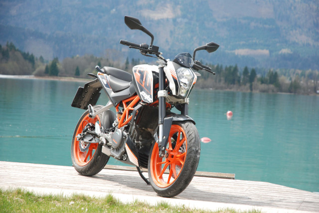 Motorcycle wooden dock lake mountains free wallpaper - medium preview image