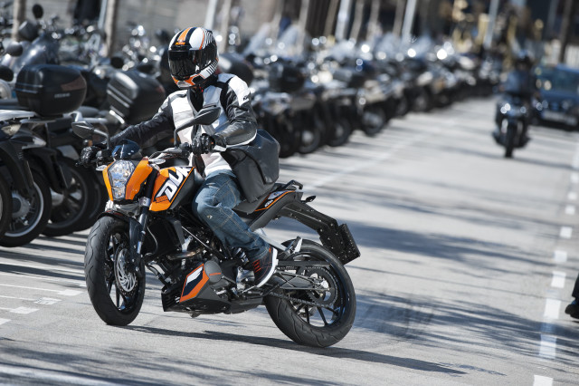 Man riding motorcycle street parking free wallpaper - medium preview image