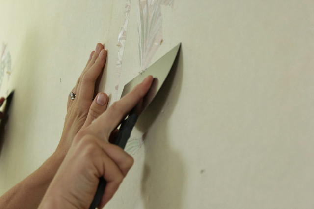 Person cutting paper wall scissors free wallpaper - medium preview image