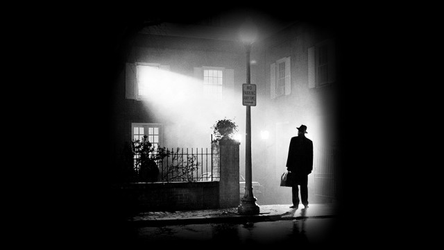 Man standing street corner dark free wallpaper - medium preview image