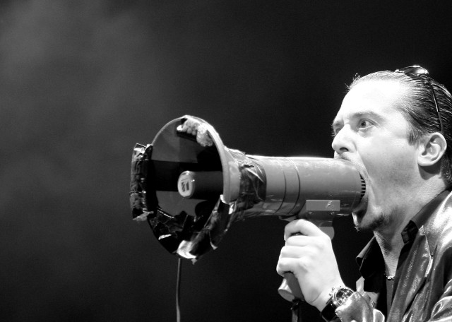 Man holding megaphone singing microphone free wallpaper - medium preview image