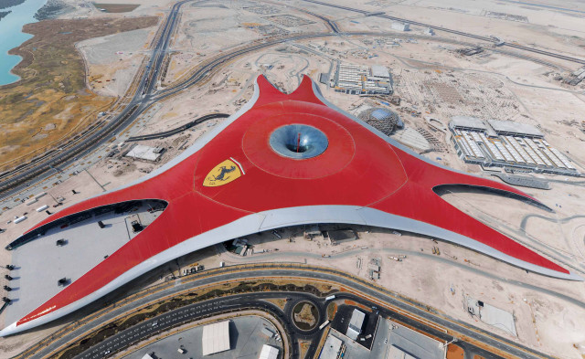 Red airplane flying airport buildings free wallpaper - medium preview image