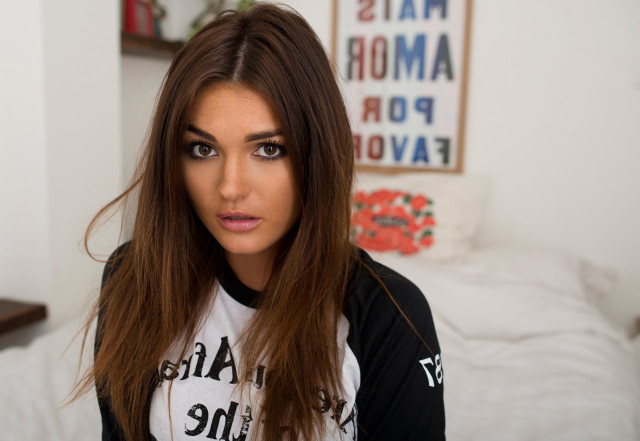 Woman longhair blackshirt bed browneyes free wallpaper - medium preview image