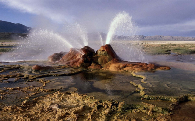 Geyser spewing water rock formation free wallpaper - medium preview image