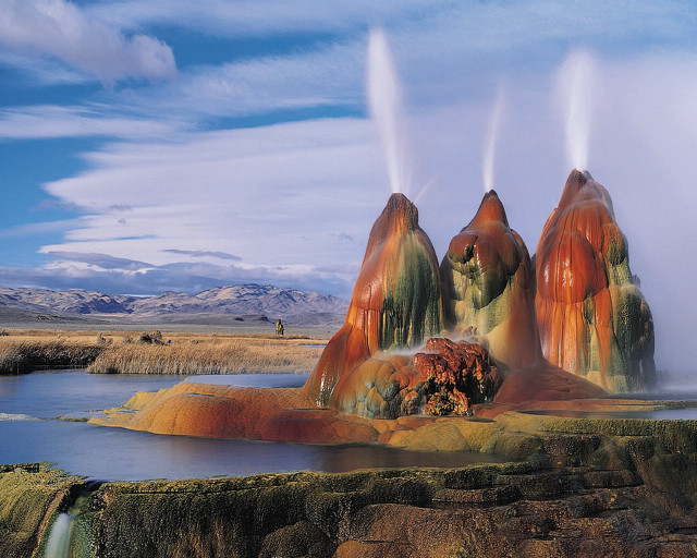 Geyser water spraying mountains background free wallpaper - medium preview image
