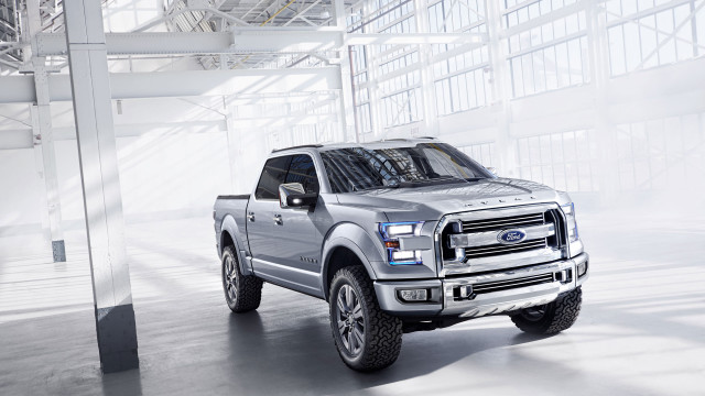 Silver truck large building sky free wallpaper - medium preview image