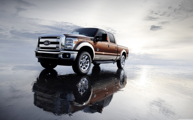 Truck parked reflective surface sky free wallpaper - medium preview image