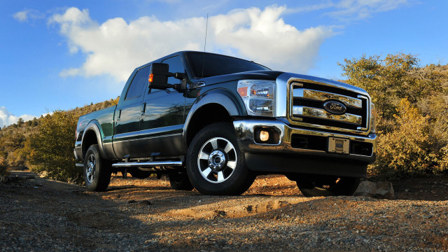Black truck dirt road forest free wallpaper - medium preview image