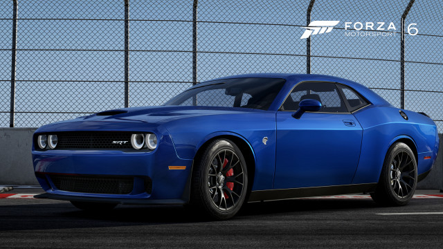 Blue sports car parked fenced free wallpaper - medium preview image