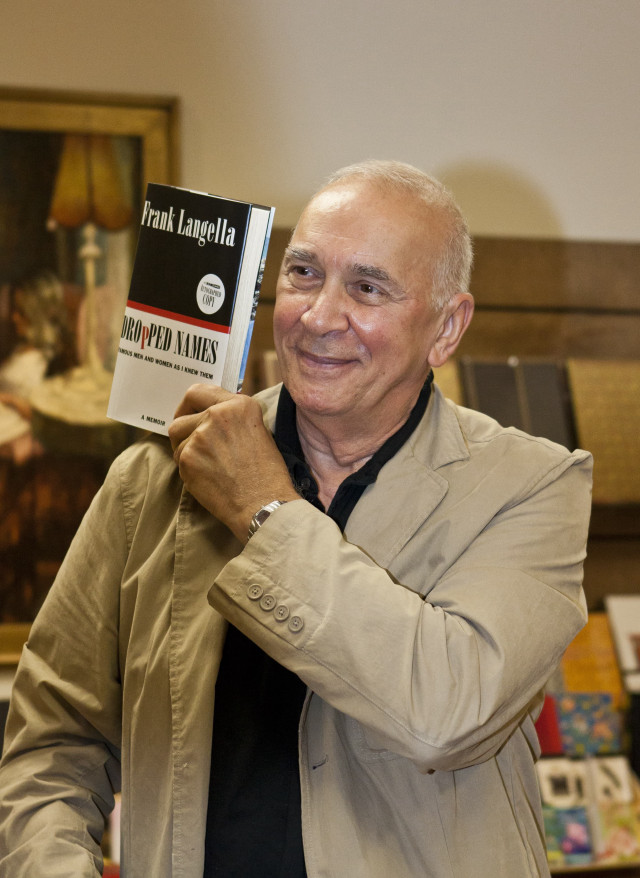 Man holding book smiling camera free wallpaper - medium preview image