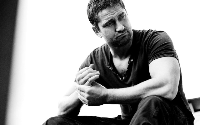 Man sitting floor hands folded free wallpaper - medium preview image